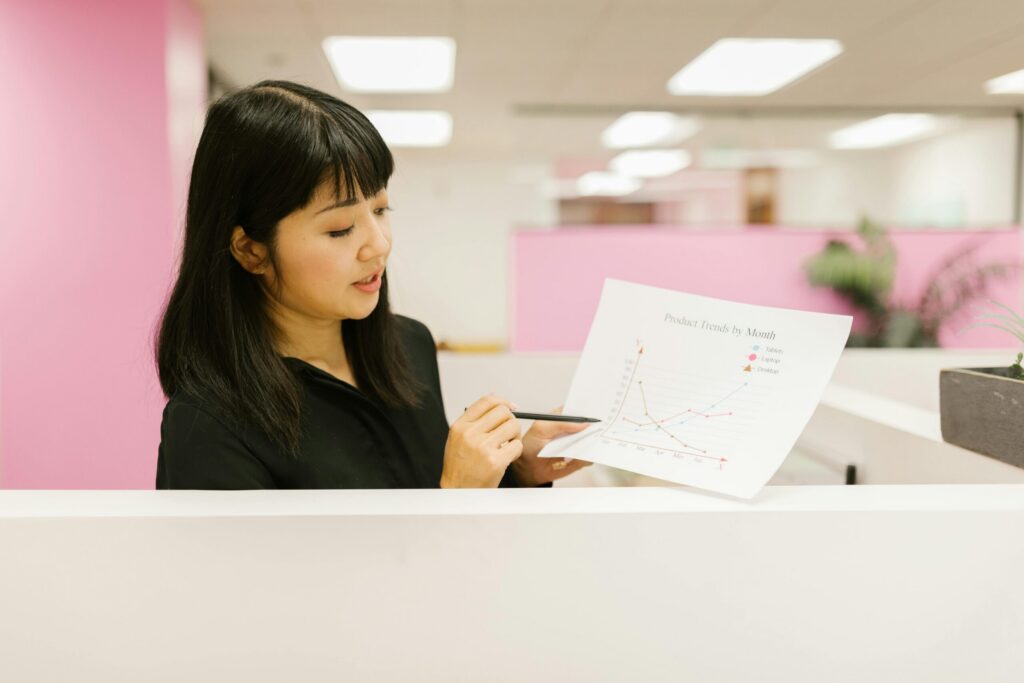 Sales and marketing specialist holding a chart